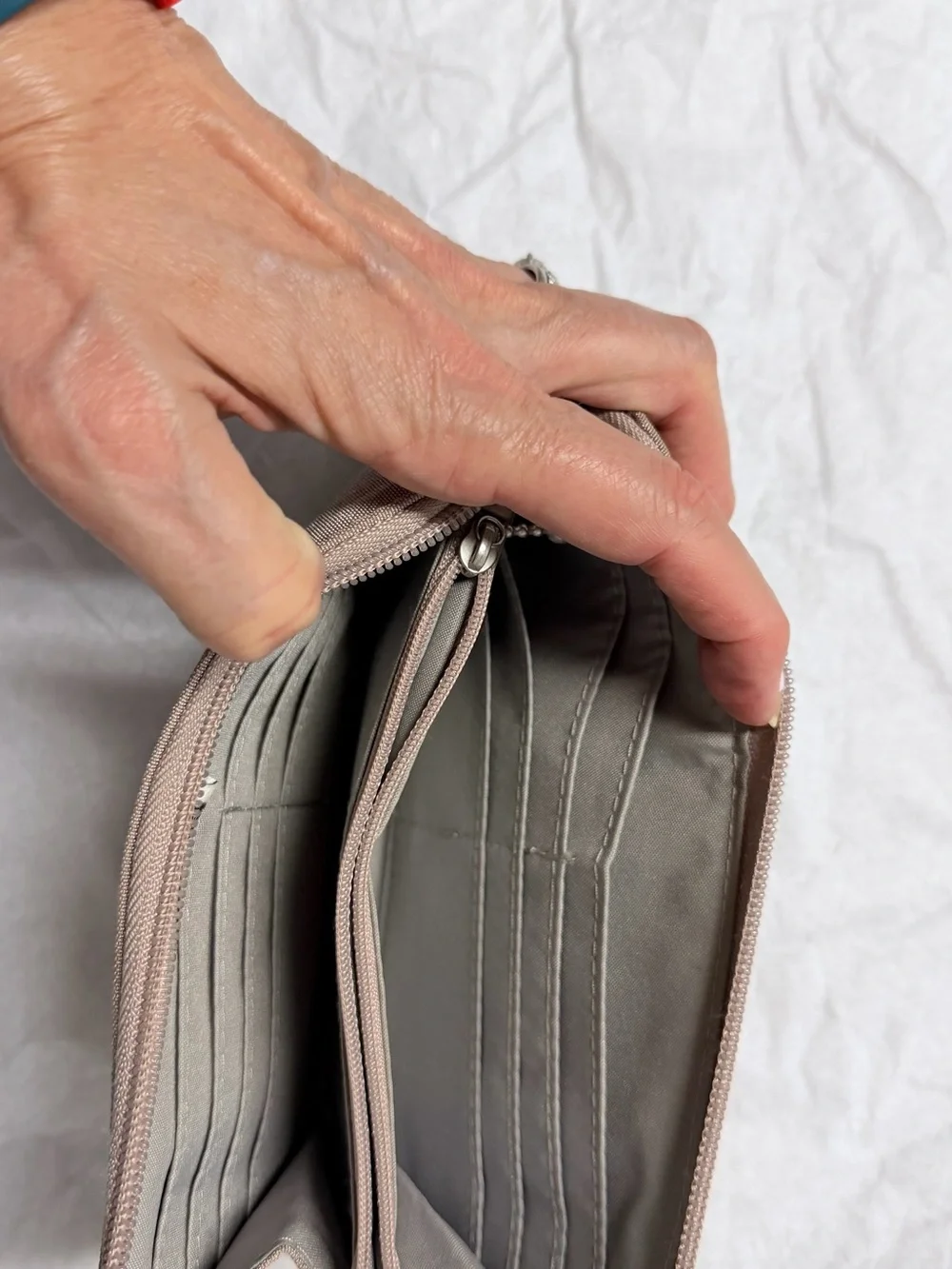 Baggallini taupe wristlet clutch with zip pockets